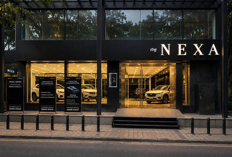 Front exterior of NEXA Pratham Motors showroom on Museum Road Bengaluru featuring premium Maruti Suz