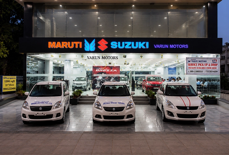 Inside look at Varun Motors Maruti Suzuki car dealership lounge and finance assistance desk in Malle